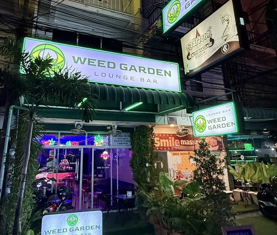 Look for the green WEED GARDEN LOUNGE BAR sign above the entrance.